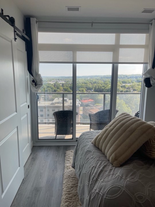 Light-filtering roller shades on a condo balcony door