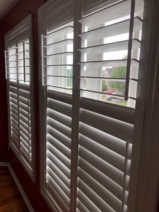 White shutters with the top panels folded open